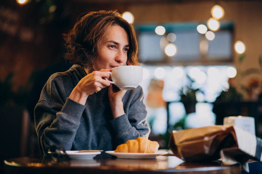 croissants with coffee Why is drinking coffee so popular around the world?