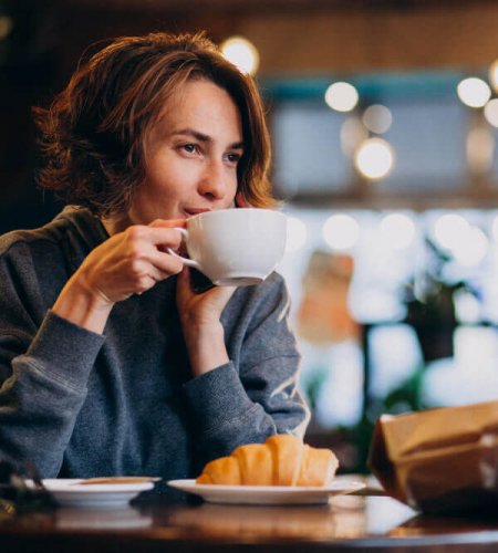 croissants with coffee Why is drinking coffee so popular around the world?